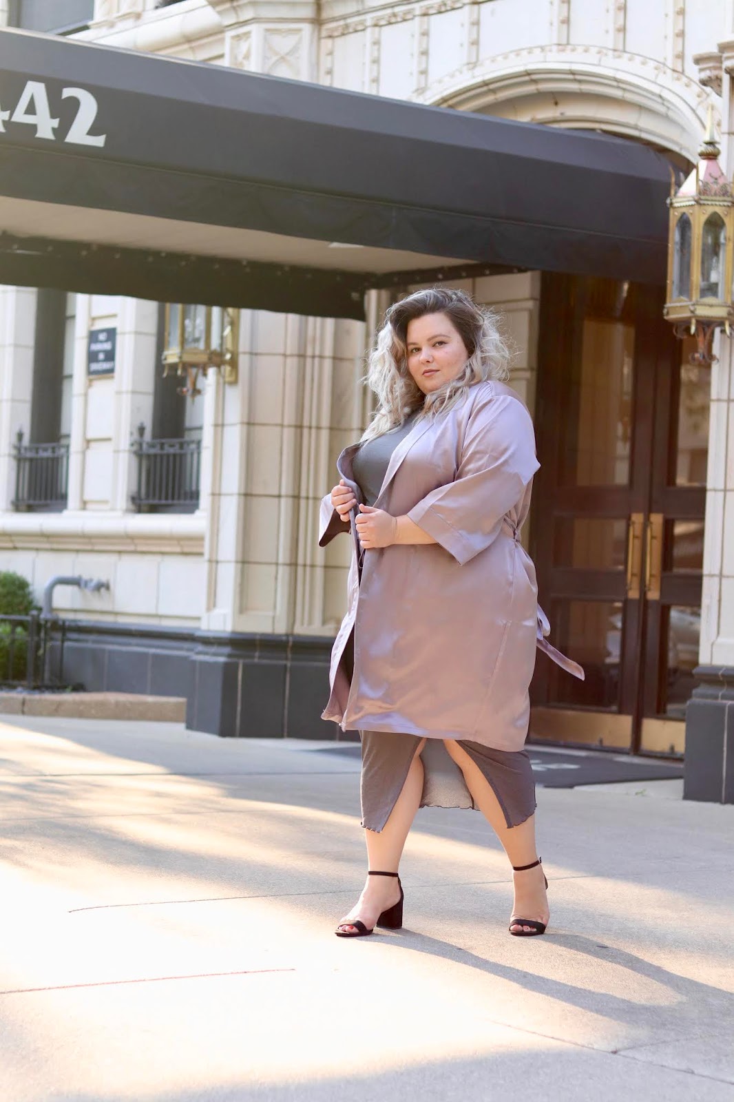 Chicago Plus Size Petite Fashion Blogger, influencer, YouTuber, and model Natalie Craig, of Natalie in the City, reviews Soncy's satin robe kimono duster in lavender, and the brand's see through mesh dress with a slit.
