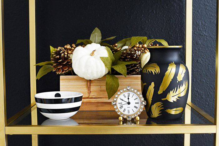 Recreate the $298 Futura Feathers Vase for about $5-$10 with this super easy DIY tutorial inspired by Jonathan Adler. The black and gold colors look chic!