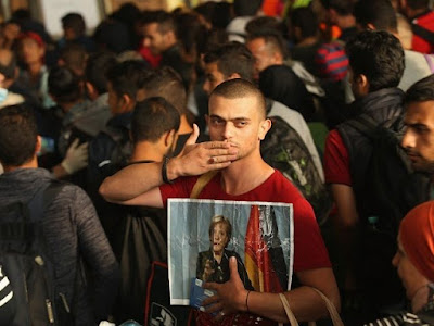 Merkel-Migrants-640x480.jpg