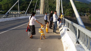 A small child looks at tourists in Vietnam