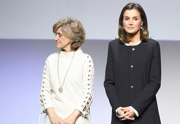 Queen Letizia wore Hugo Boss silk blouse, Caolina Herrera jacket and, Mango Prince of Wales trousers and pearl earrings