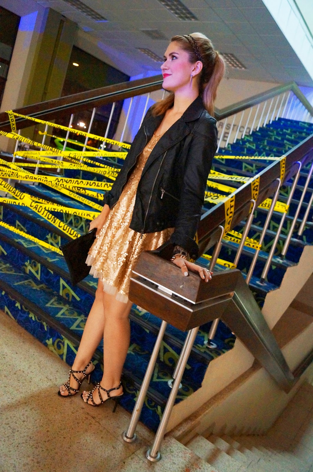 Add a motorcycle jacket to a gold sequin dress to look edgy!