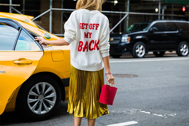 Red Birkin Bag and Pom Pom outside New York Fashion Week 2016