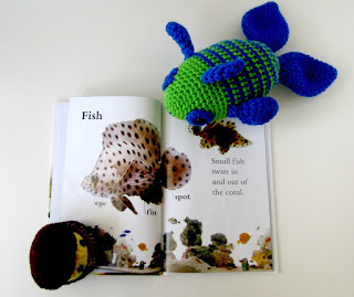 Plush toy tropical fish reading Fishy Tales