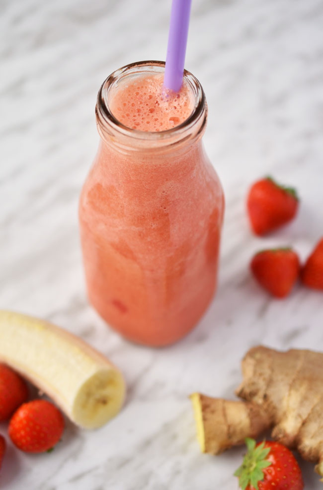 Woman in Real Life Grapefruit, Carrot, Ginger Juice Smoothie (Vegan