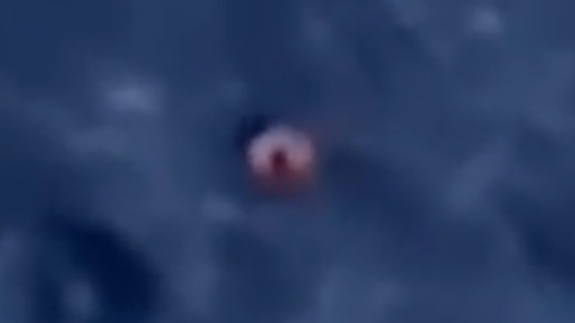 A-close-up-look-at-the-UFO-between-the-Earth-and-the-Moon-on-telescope.