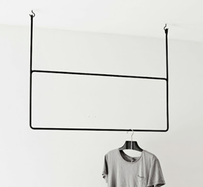 clothing rack that hangs from the ceiling