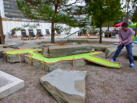 Playing hole 5 of the Putt Putt #2 art installation - a very long and winding hole built around the rocks TURF Projects Putt Putt #2 Crazy Golf course at Platform Ruskin Square in Croydon