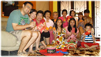 Group photo of family and relatives at Say Bee and Colin's home