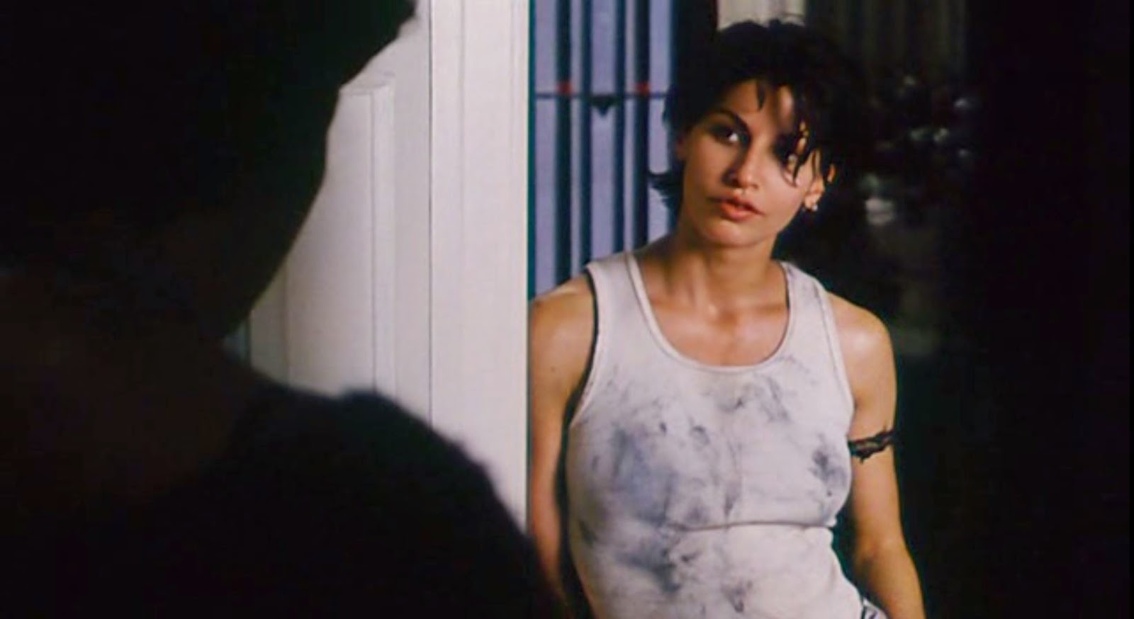 Corky (Gina Gershon) is short-haired masculine dressing, is good with her h...