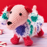 http://www.topcrochetpatterns.com/free-crochet-patterns/snowy-the-dachshund