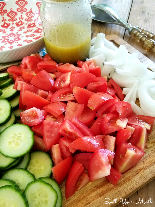 Cucumber & Tomato Salad with a Simple Summer Vinaigrette | A simple recipe for a perfect summer salad made with cucumbers, tomatoes, onions and an easy oil and vinegar dressing.