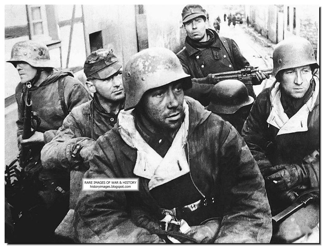 german-soldiers-patrol-street-german-town-in-armored-personnel-carrier-march-1945.jpg