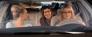 Penny, Amy and Bernadette in Bernadette's car. She's driving, Penny's in the front passenger seat, and Amy's in the back.