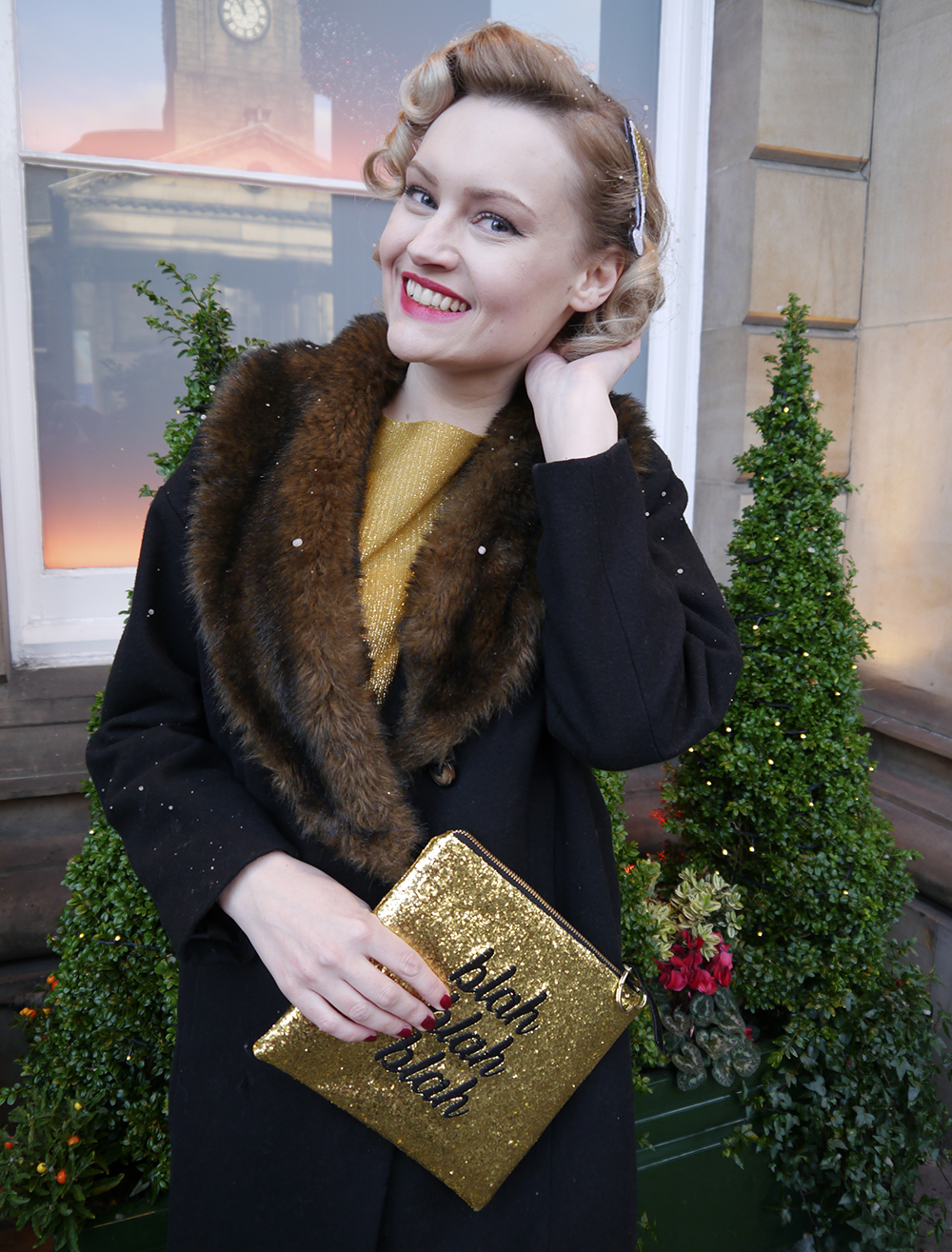 Vintage Christmas Party style with fashion blogger Wardrobe Conversations British vintage style blogger, fake snow in Edinburgh, faux fur trimmed Henry Holland coat, gold glitter clutch for christmas party, easy vintage pincurl style with tongs, fashion blogger christmas outfit,