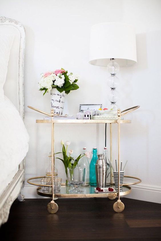 Decor Inspiration A gold bar cart makes a charming and creative bedside table Cool Chic