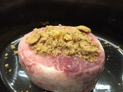 raw gammon and brown sugar in a slow cooker