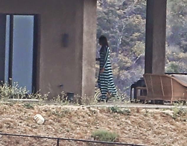Photos: Bruce Jenner wears a long slit dress