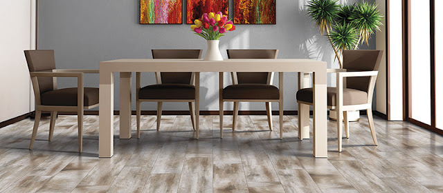 Light hardwood floor enlarges this dining room 