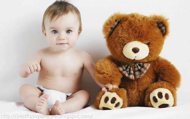  Baby and bear toy.