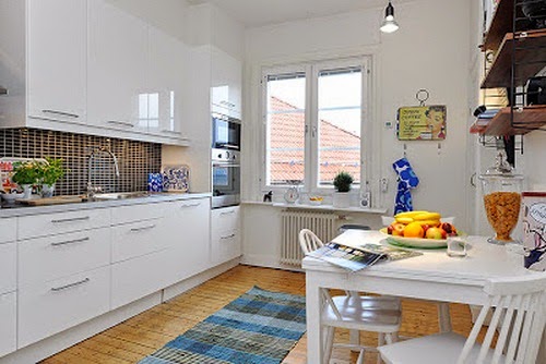 Beautiful White Room with Blue Sofa with White Dining