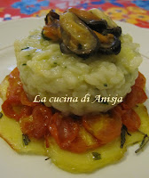 http://lacucinadianisja.blogspot.it/2013/01/riso-con-pomodori-patate-e-cozze.html