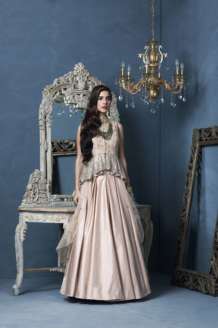 Peplum top in textured silk worn over plain duchess skirt by Designer Rashi Kapoor Peplum top in textured silk worn over plain duchess skirt by Designer Rashi Kapoor