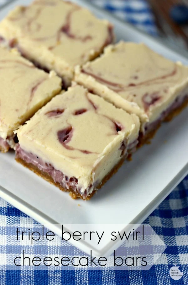 Triple Berry Swirl Cheesecake Bars | by Renee's Kitchen Adventures - easy recipe for perfect cheesecake swirled with sweet summer berries