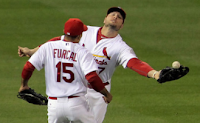Matt Holliday and Rafael Furcal of the St. Louis Cardinals collide during the fourth inning of Game 6 of the 2011 World Series