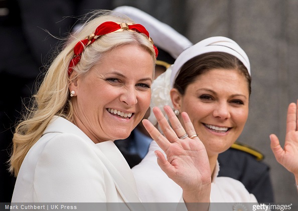 Crown Princess Mette-Marit of Norway and Crown Princess Victoria of Sweden leave the Town Hall after lunch during festivities for the 75th birthday of Queen Margrethe II Of Denmark