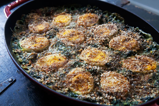 This spinach gratin casserole topped with bread crumbs and hard boiled eggs is out of this world.