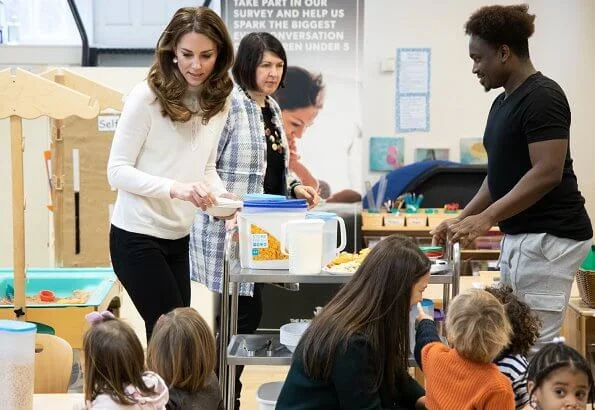 Kate Middleton wore Sezane Tulio jumper, Russell and Bromley FAB Dry ankle boots, Accessorize Filigree gold earrings, a blue wool coat