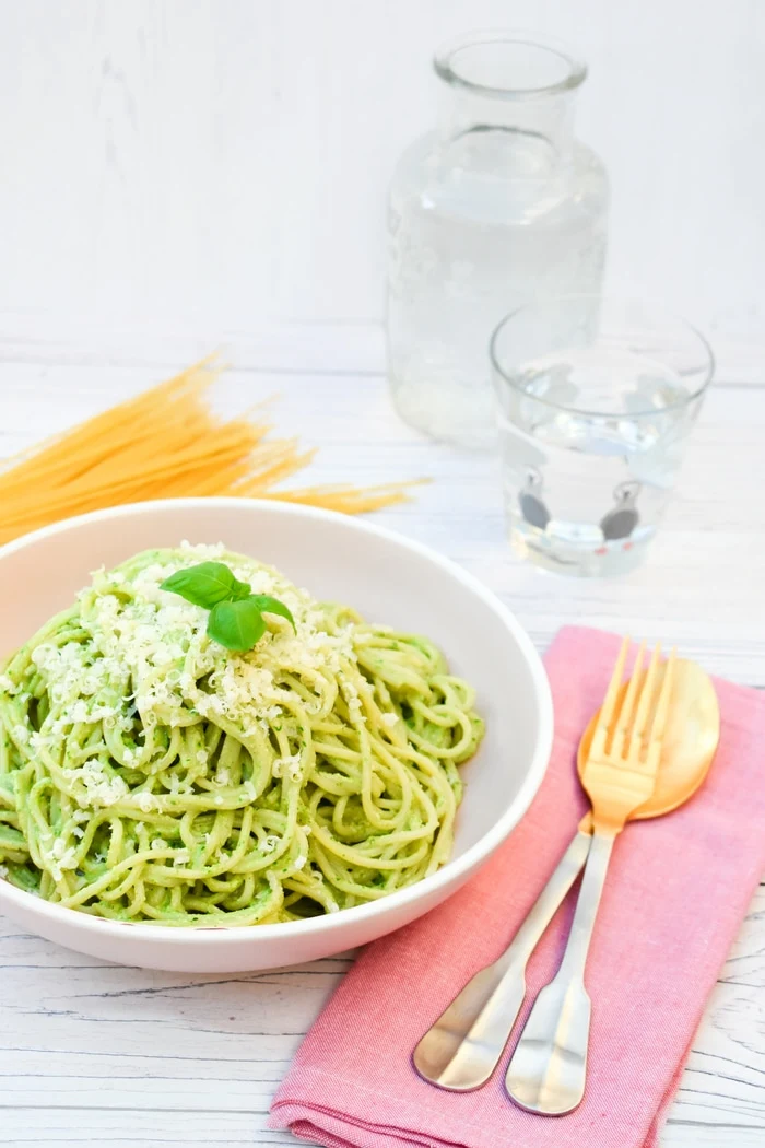 Kale and Cashew Pesto Spaghetti topped with grated parmesan and fresh basil