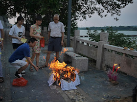 people burning ghost money in Ganzhou