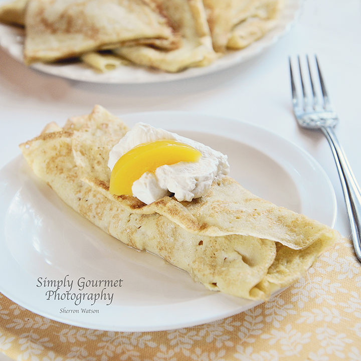 Simply Gourmet Crepes with Peaches and Whipped Cream