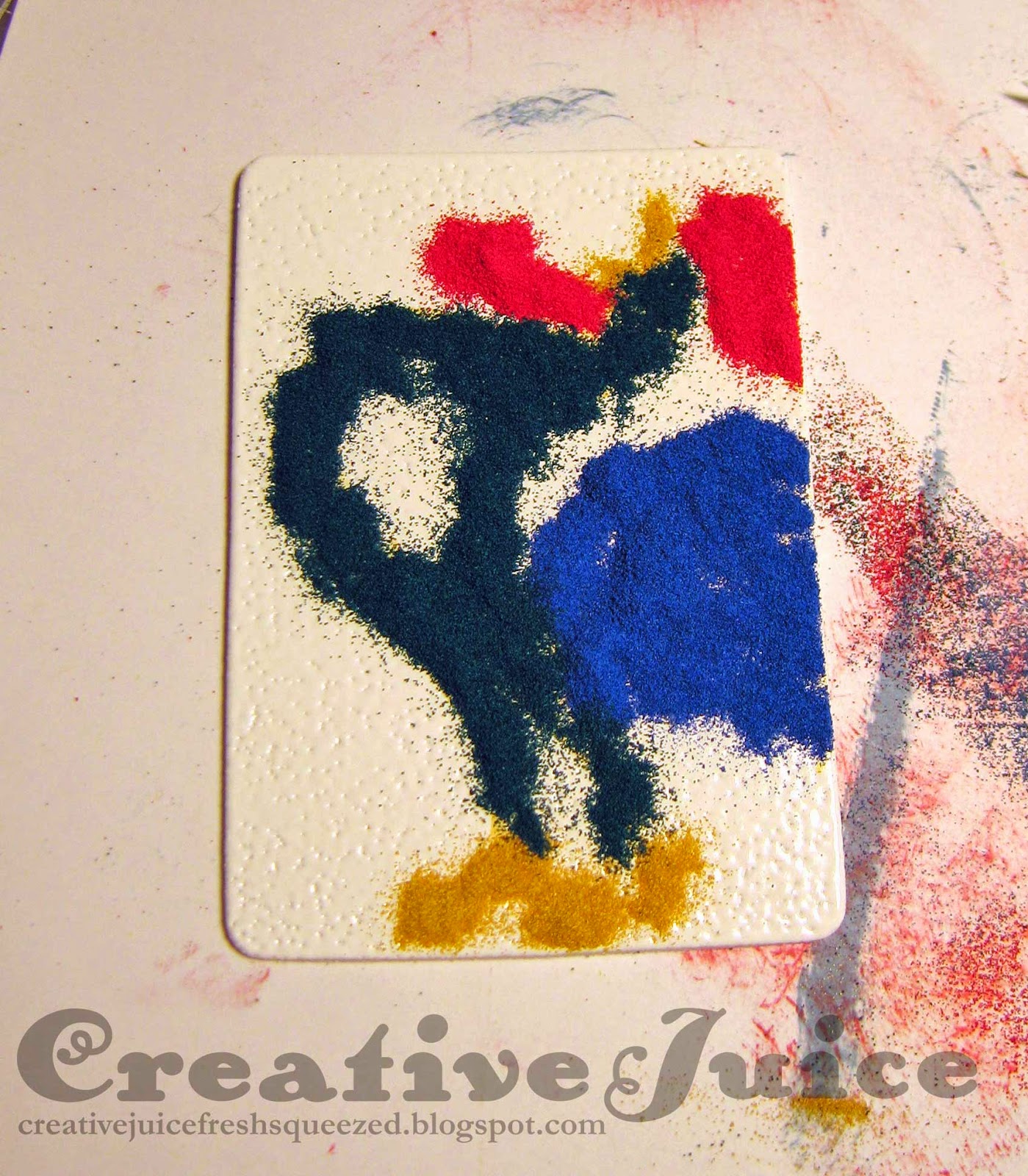 step 2 – carefully add the various colors of embossing powder