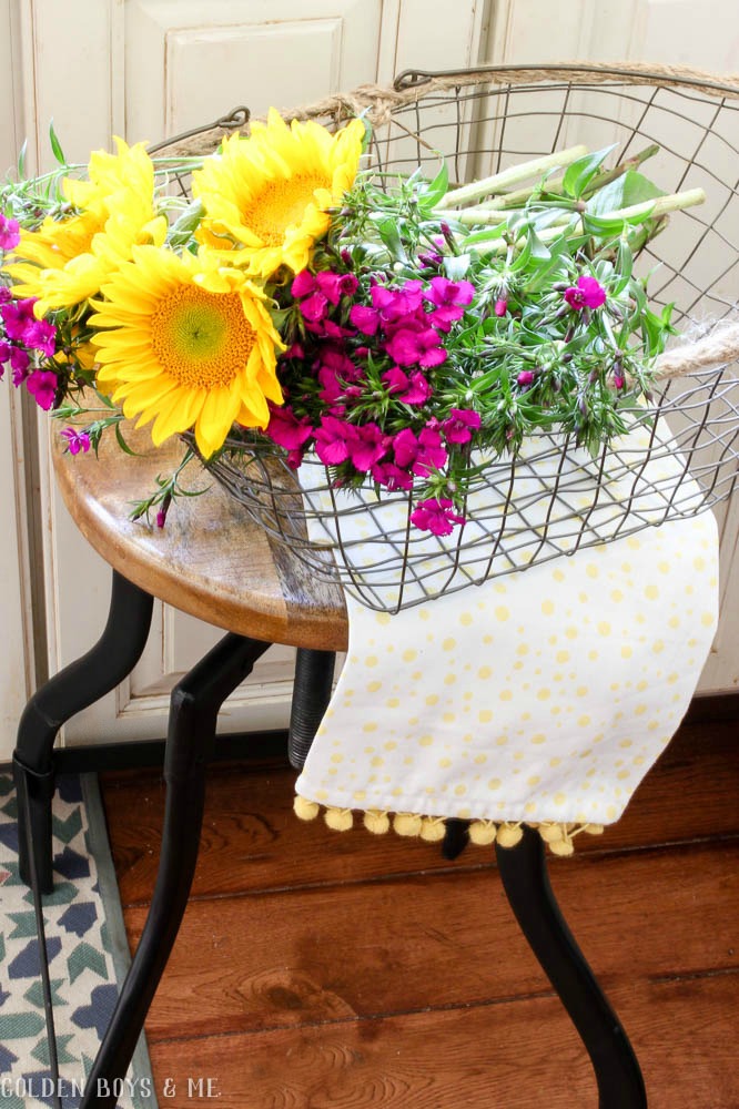 Farmhouse style basket with flowers in kitchen