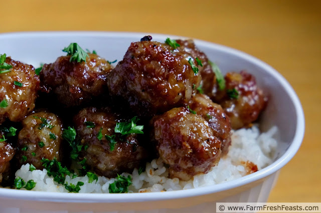 photo of a dish of Gluten Free Asian Maple Sausage Meatballs served over rice