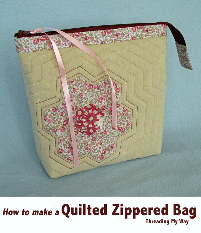 Make a zippered bag with Liberty, hexagons, flowers and echo quilting. Use it as a makeup bag, toiletry bag - lots of uses ~ Threading My Way