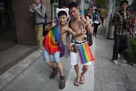 two young men with rainbow flags at 2011 Taiwan LGBT Pride Parade