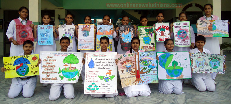 Students shows posters made by them during Van Mahotsava Week at Green Land Students shows posters made by them during Van Mahotsava Week at Green Land