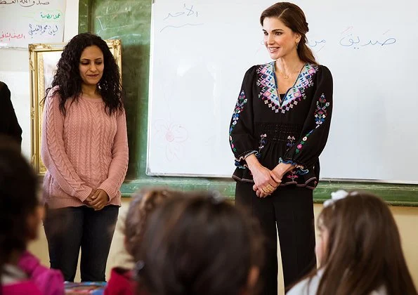 Queen Rania announced of financial support for families. Queen wears Victoria Beckham blouse from Spring/Summer 2018 Fashion collection