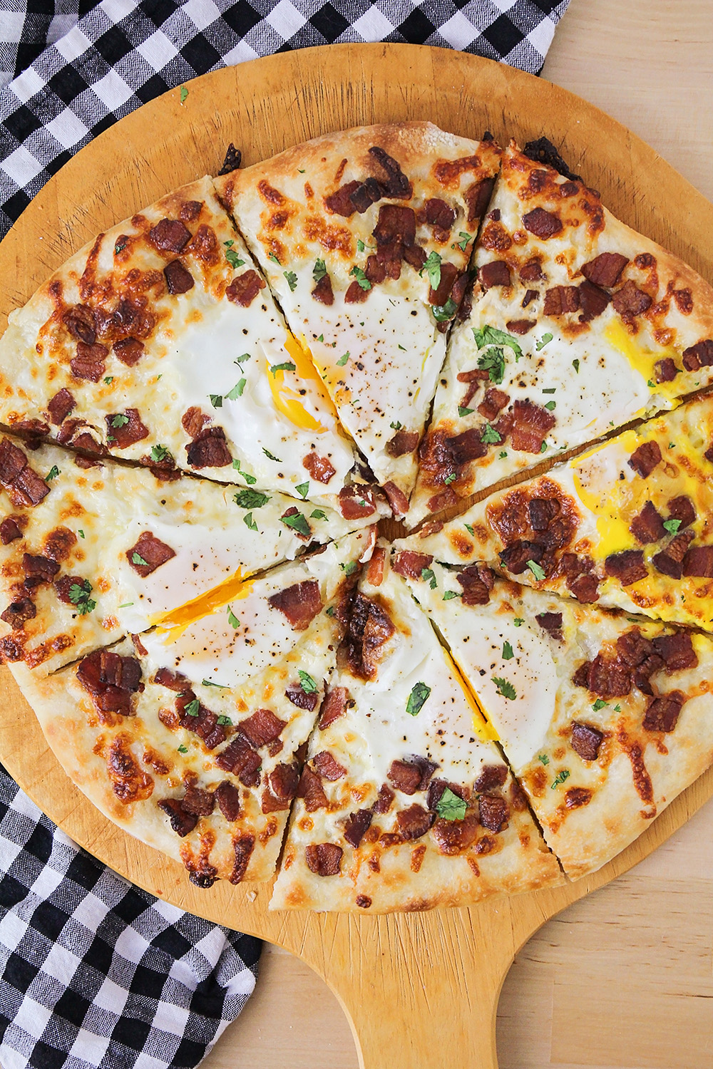 This bacon breakfast pizza is perfect for any meal of the day! It's so flavorful and delicious, and easy to make too!