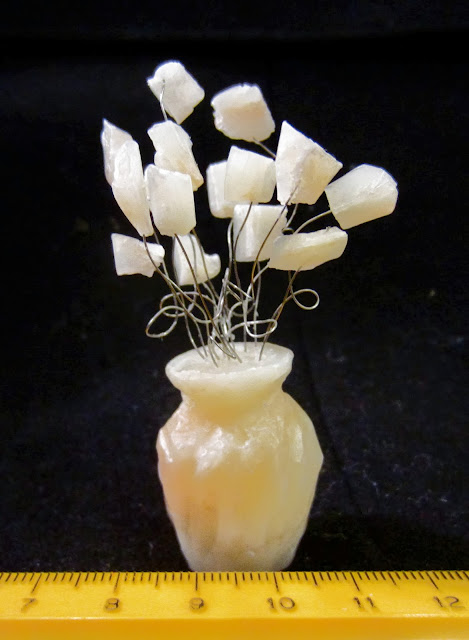 sculpture of flowers in a vase carved from soap