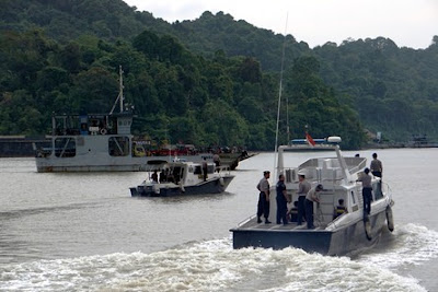 Police boats patrol the strait between Cilacap and Nusakambangan Island