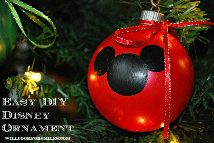 red mickey mouse christmas ornament on a christmas tree 