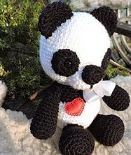 http://www.ravelry.com/patterns/library/the-panda-bear---amigurumi-crochet-pattern