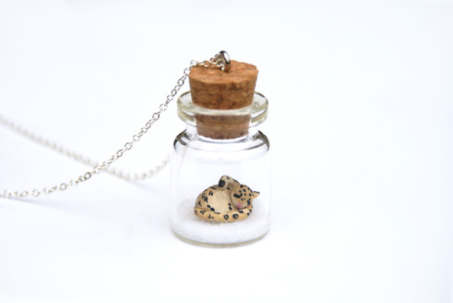 https://www.etsy.com/uk/listing/169717067/snow-leopard-jar-necklace-miniature-wild