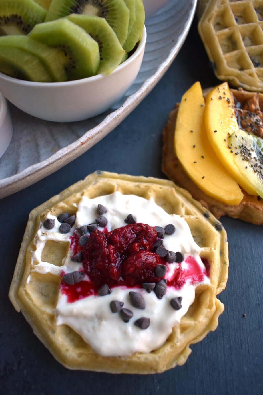 Make Your Own Waffle Bar features tons of fun toppings including fresh fruit, nuts, yogurt, raspberry sauce, maple syrup, peanut butter, chocolate chips and more! www.nutritionistreviews.com