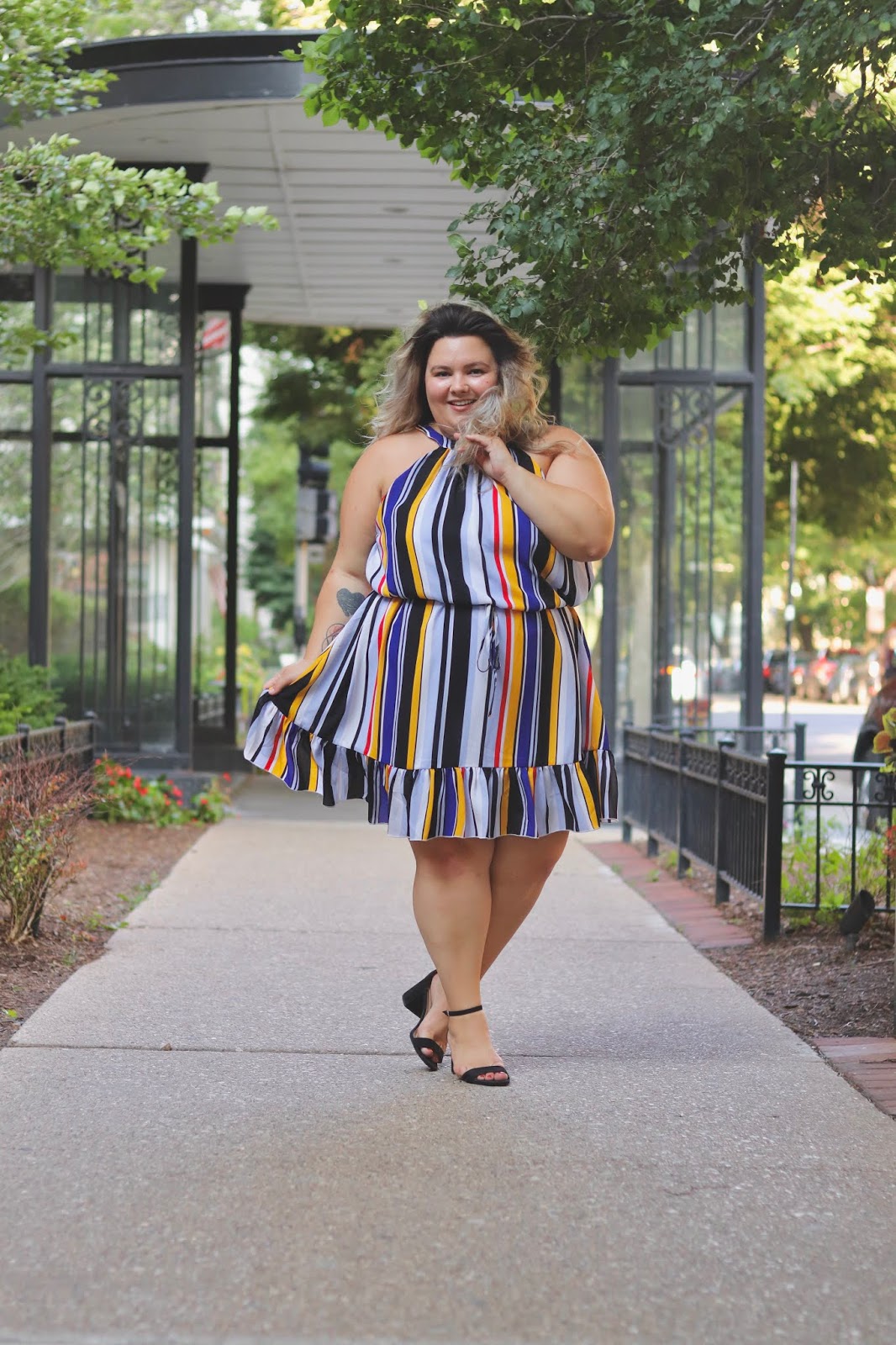 Chicago Plus Size Petite Fashion Blogger, influencer, YouTuber, and model Natalie Craig, of Natalie in the City, reviews Fashion to Figure's Christel Striped Ruffle Flounce Dress.